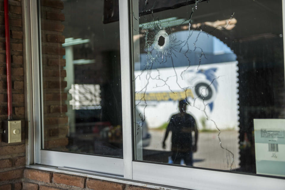 A bullet hole fragments the window of a building, from a recent shootout in Culiacan, Mexico, Saturday, Oct. 26, 2019. The physical scars of the Oct. 17 gunbattles _ what’s come to be known as “black Thursday” by residents of Culiacan, the capital of Sinaloa and a stronghold of the Sinaloa cartel long led by Joaquín “El Chapo” Guzmán _ are beginning to heal, but residents are still coming to grips with the worst cartel violence in recent memory. (AP Photo/Augusto Zurita)