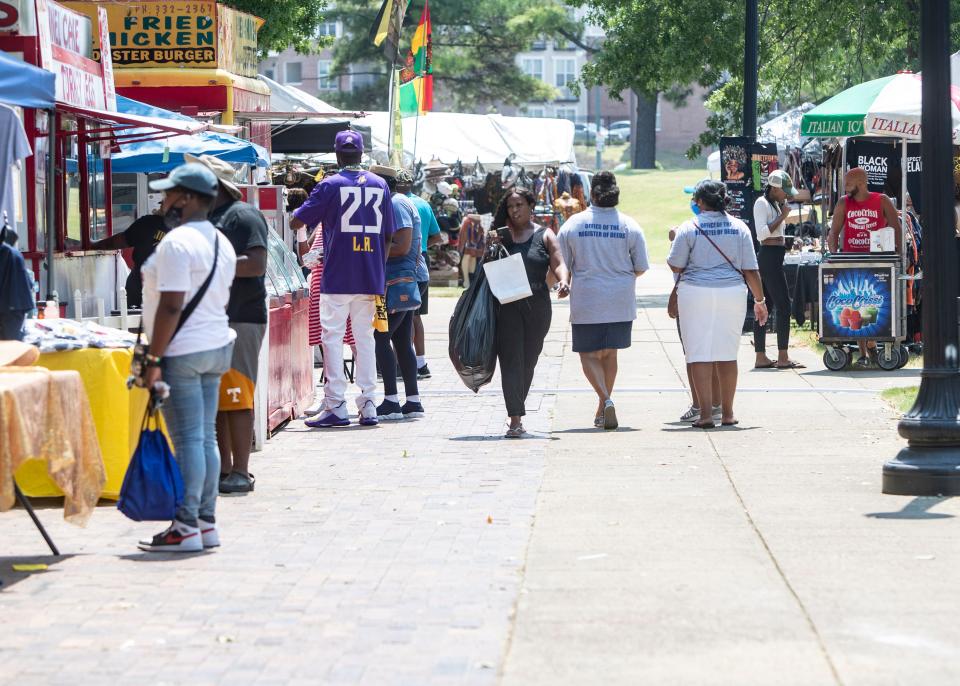 Festival vendors are lined up to serve customers a variety of food, clothing and jewelry from different regions of Africa during the 34th Africa in April event in Downtown Memphis on Aug. 7, 2021.