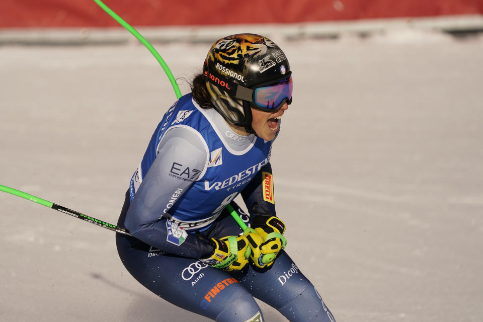 Italy's Federica Brignone reacts after completing an alpine ski, women's World Cup Super G race, in Val d'Isere, France, Sunday, Dec. 17, 2023. (AP Photo/Giovanni Auletta)