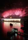 Fireworks light up the sky above the Sydney Harbour Bridge at midnight during New Years Eve celebrations on Sydney Harbour on December 31, 2012 in Sydney, Australia. (Cameron Spencer/Getty Images)