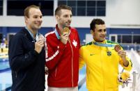 Ryan Feeley of the United States (left) , Ryan Cochrane of Canada (middle) and Leonardo De Deus of Brazil (right) pose with their medals after the men's 400m freestyle final the 2015 Pan Am Games at Pan Am Aquatics UTS Centre and Field House. Rob Schumacher-USA TODAY Sports