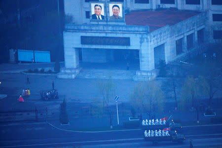Military trucks carry soldiers through central Pyongyang before sunset as the capital preparers for a parade marking today's 105th anniversary of the birth of Kim Il Sung, North Korea's founding father and grandfather of the current ruler, April 15, 2017. REUTERS/Damir Sagolj