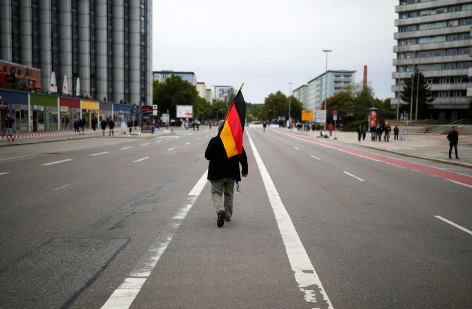 <p>A supporter of the far-right “Pro Chemnitz” holds a flag during a demonstration in Chemnitz, Germany, Sept. 1, 2018. (Photo: Hannibal Hanschke/Reuters) </p>