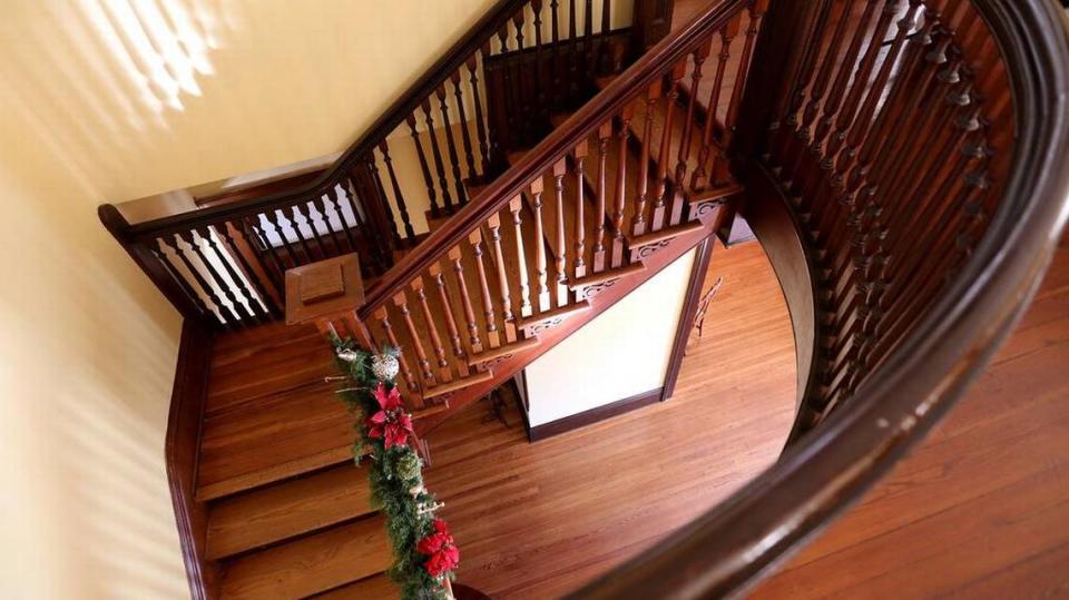 The main staircase at the Redding House in Biloxi shows the character and craftsmanship of the 1908 home.