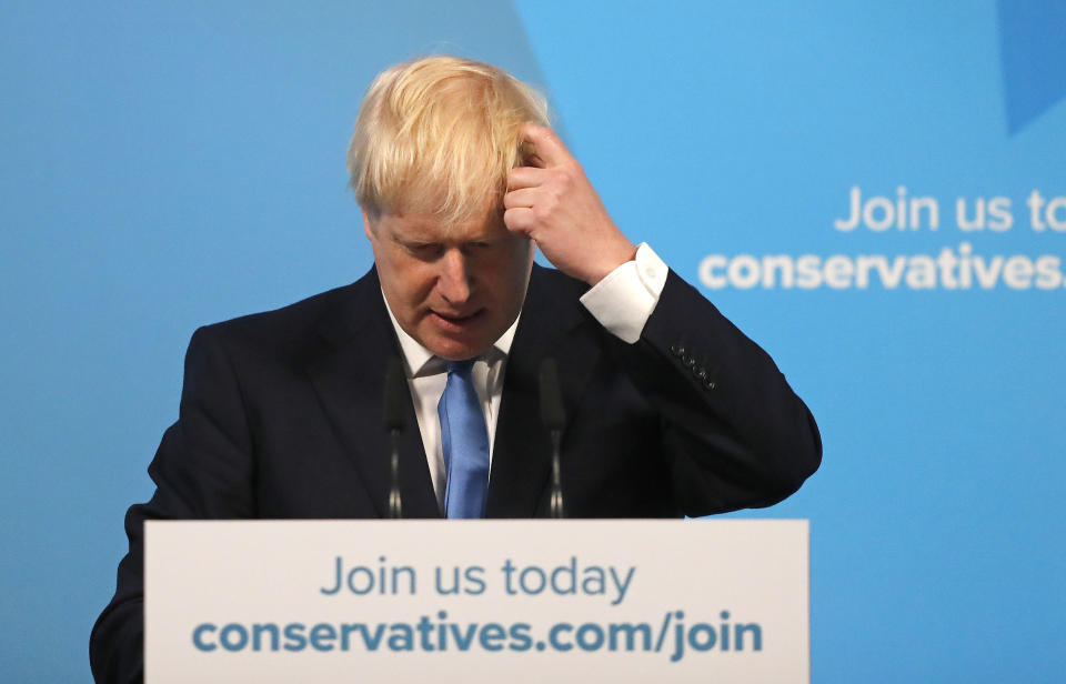 Boris Johnson scratches his head as he speaks after being announced as the new leader of the Conservative Party in London, Tuesday, July 23, 2019. Brexit champion Boris Johnson won the contest to lead Britain's governing Conservative Party on Tuesday, and will become the country's next prime minister. (AP Photo/Frank Augstein)