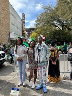 Alex, Ny-Jariah and Jordan Simpkins watched the parade from outside the Savannah Theatre.