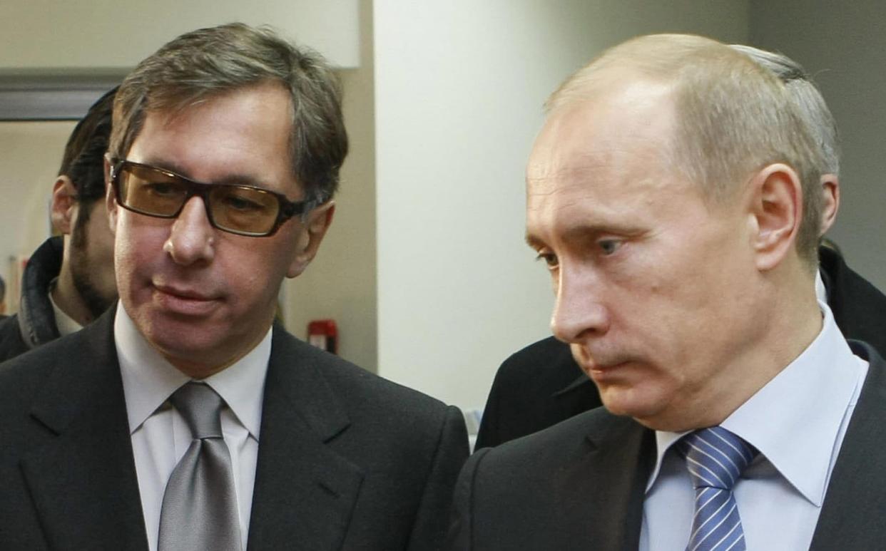 Vladimir Putin and Petr Olegovich Aven - AFP via Getty Images
