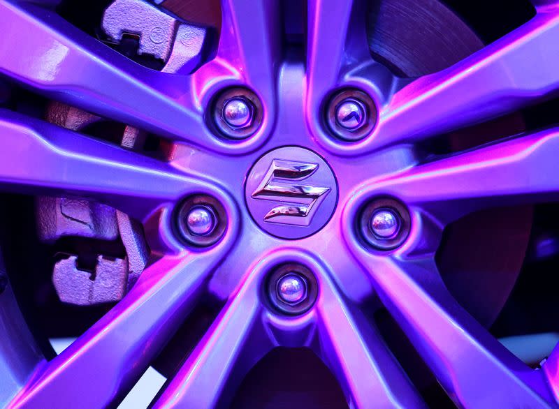 FILE PHOTO: The logo of Suzuki is seen on a wheel of Maruti Suzuki Vitara Brezza car during its launch in Mumbai