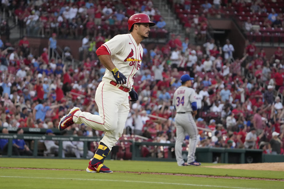 St. Louis Cardinals' Nolan Arenado, left, rounds the bases after hitting a solo home run off New York Mets starting pitcher Kodai Senga during the fourth inning of a baseball game Saturday, Aug. 19, 2023, in St. Louis. (AP Photo/Jeff Roberson)