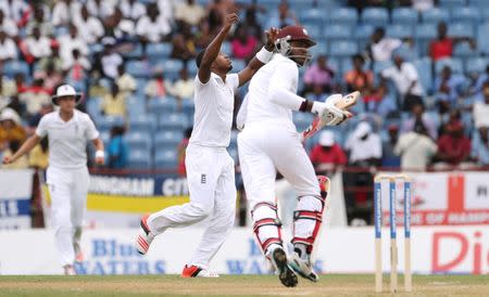 England's Chris Jordan reacts as Alastair Cook dropped a catch to dismiss West Indies' Marlon Samuels. Reuters / Jason O'Brien