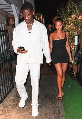 <p>Rachpoot/Bauer-Griffin/GC Images</p> Damson Idris and Lori Harvey hold hands during a night out in Santa Monica, California.