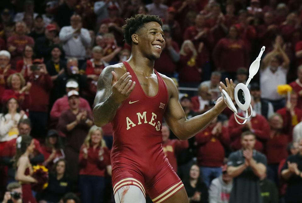 Iowa State's David Carr celebrates after defeating Iowa's Michael Caliendo during their 165-pound match at Hilton Coliseum, Nov. 26, 2023, in Ames.