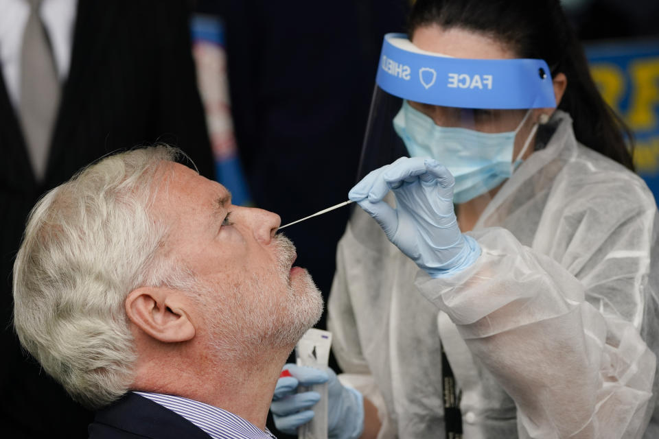 Metropolitan Transportation Authority chairman and CEO Patrick Foye gets a Covid test after a news conference to announce plans for the testing of its workers Tuesday, Oct. 27, 2020, at the Grand Avenue Bus Depot in New York. (AP Photo/Frank Franklin II)