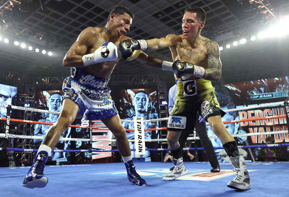 LAS VEGAS, NV - FEBRUARY 20: Miguel Berchelt and Oscar Valdez exchange punches during their fight for the WBC super featherweight title at the MGM Grand Conference Center on February 20, 2021 in Las Vegas, Nevada. (Photo by Mikey Williams/Top Rank Inc via Getty Images)