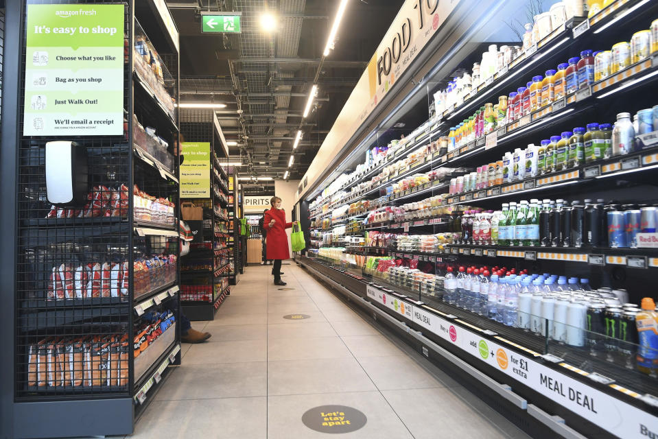 The Amazon Fresh grocery store opens to the public in London, Thursday March 4, 2021, where shoppers will be able to pick up items and walk out of the store, contactless, without the need for a till. Customers will scan a QR code on their way into the store, with cameras and technology identifying the items that shoppers take from the shelves and their account automatically paid. (Victoria Jones/PA via AP)