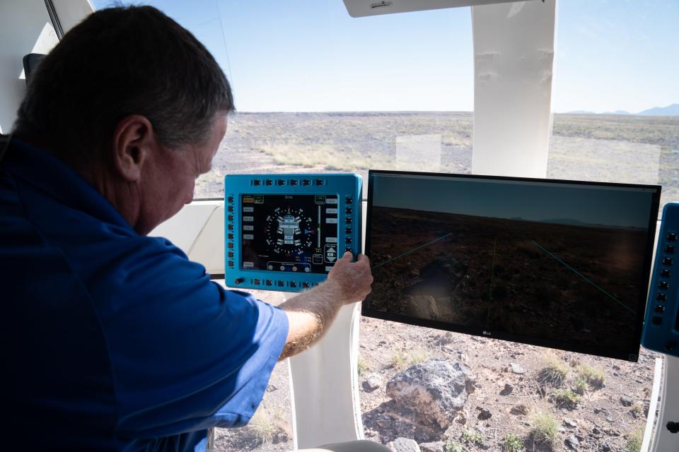 Lucien Junkin (NASA Space Exploration Vehicle chief engineer) drives the Artemis Rover during a news briefing on Oct. 24, 2022, at NASA's Desert Research and Technology Studies (Deserts RATS) Artemis' Rover Mission Simulations site at Black Point Lava Flow, located 40 miles north of Flagstaff.