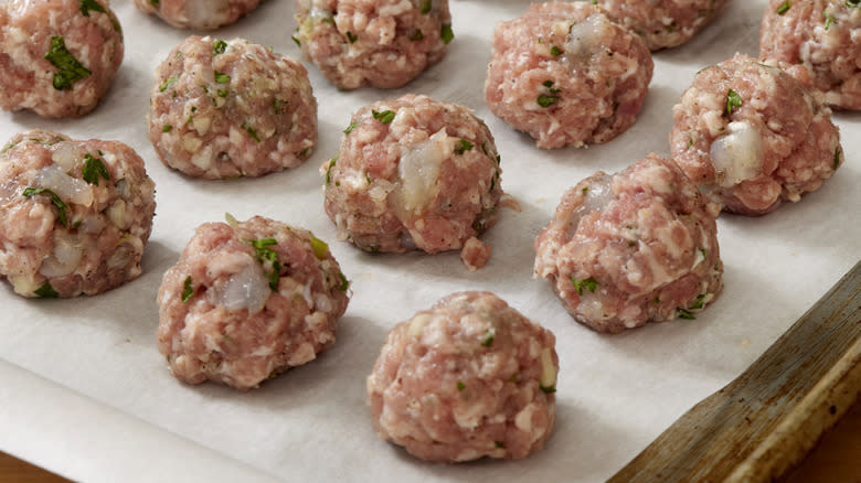 raw meatballs on wax paper