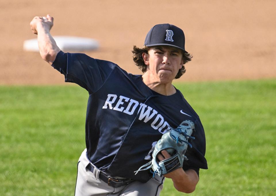 Redwood's Erik Rico pitches against El Diamante in an East Yosemite League high school baseball game Wednesday, March 13, 2024