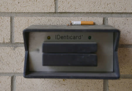 A half-burnt cigarette is placed beside the breakroom door for the next smoke break between sessions at the Barnett Community Center in Huntington, West Virginia, U.S. May 4, 2017. REUTERS/Lexi Browning