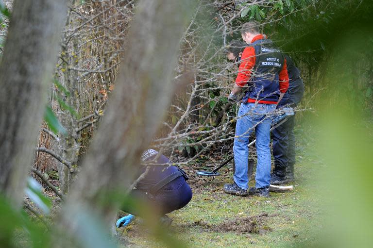 French gendarmes look for evidences on February 18, 2014 in Talloires after arresting a man in connection with the 2012 killings of a British-Iraqi family and a cyclist in the Alps