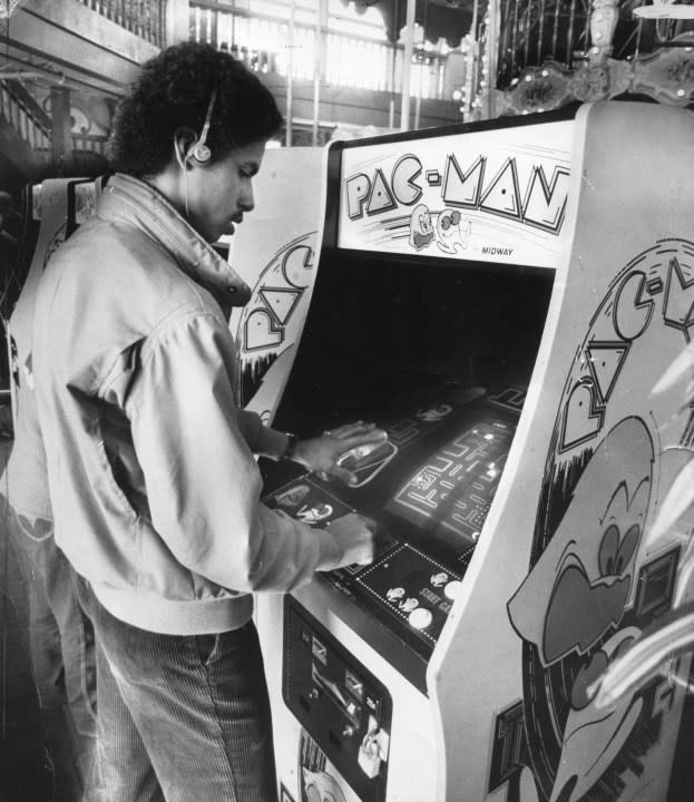 March 16, 1982: Brian Allen, 17, listens to his Walkman while playing Pac-Man at the Pier 39 arcade in San Francisco. (Photo by Steve Ringman/San Francisco Chronicle via Getty Images)