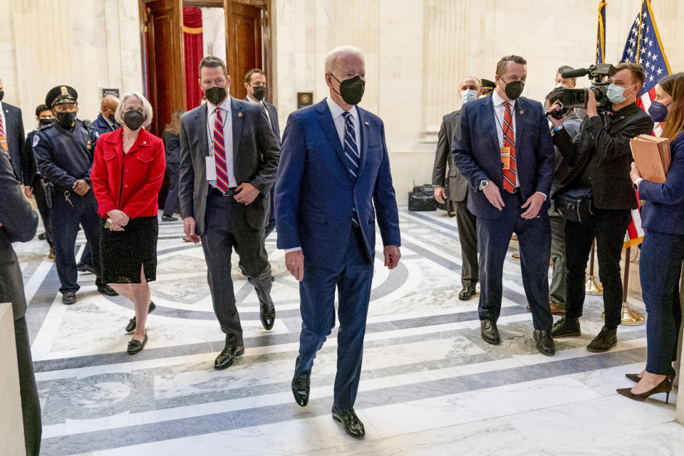 President Joe Biden leaves a meeting with the Senate Democratic Caucus to discuss voting rights and election integrity on Capitol Hill in Washington, Thursday, Jan. 13, 2022. (AP Photo/Andrew Harnik)