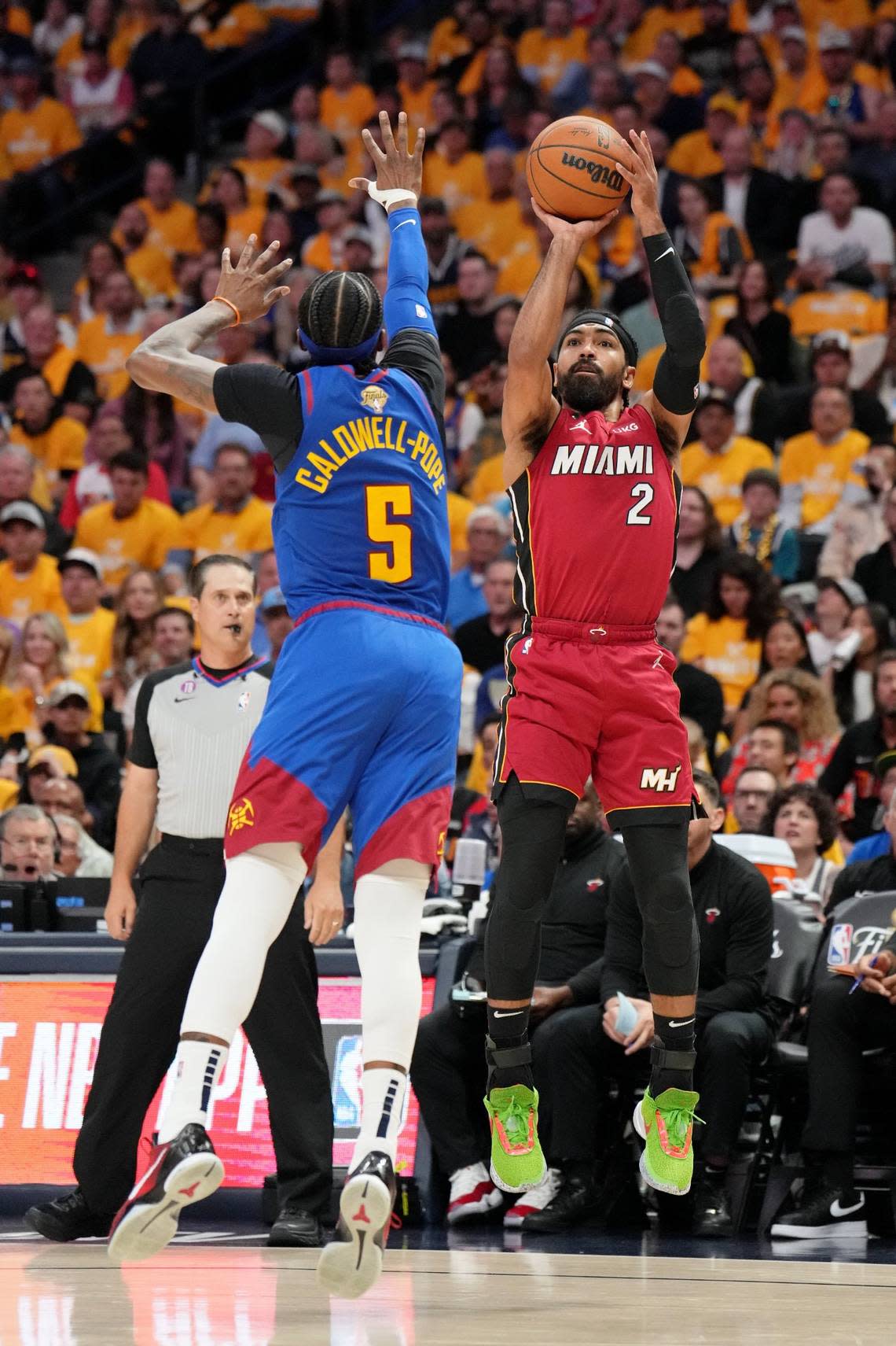 Jun 1, 2023; Denver, CO, USA; Miami Heat guard Gabe Vincent (2) shoots the ball against Denver Nuggets guard Kentavious Caldwell-Pope (5) in game one of the 2023 NBA Finals at Ball Arena. Mandatory Credit: Kyle Terada-USA TODAY Sports