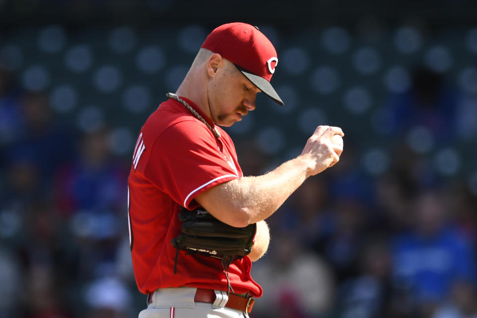 Cincinnati Reds starting pitcher Chase Anderson reacts before being pulled during the first inning of a baseball game against the Chicago Cubs, Sunday, Oct. 2, 2022, in Chicago. (AP Photo/Paul Beaty)