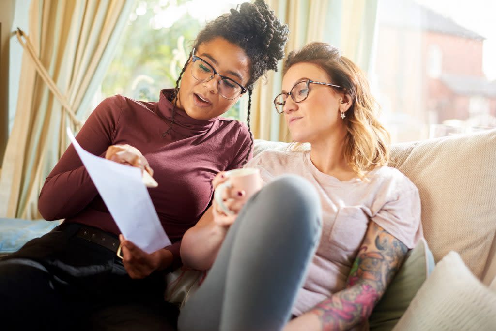 Two women go over their finances together.