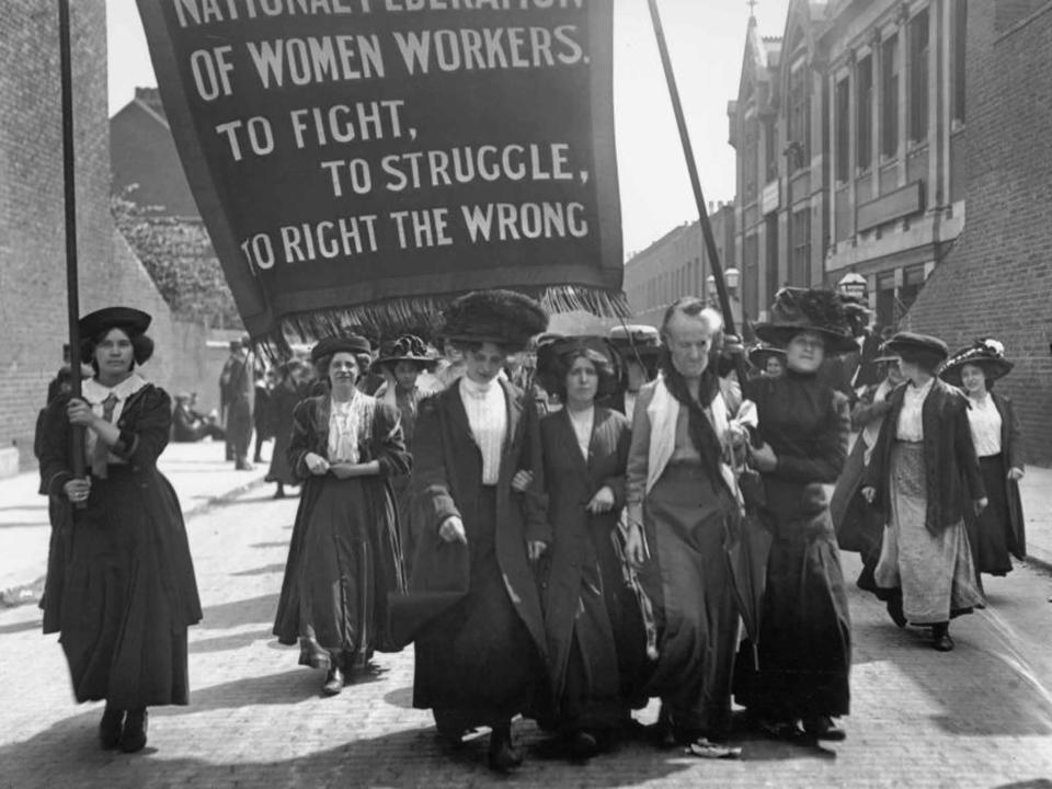 May 1911: British suffragette Charlotte Despard (1844 - 1939) (wearing a white waistcoat) heads a march of the National Federation of Women Workers through Bermondsey in South London (Getty): Getty