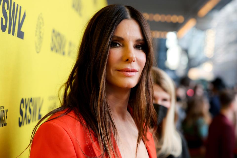 Sandra Bullock stars as romance novelist Loretta Sage in "The Lost City." She poses on the red carpet at the film's premiere on March 12 at the Paramount Theatre during SXSW.