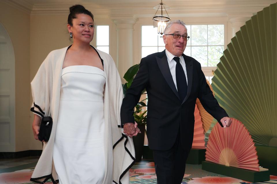 Robert De Niro, right, and Tiffany Chen arrive at the White House for a state dinner on April 10, 2024, in Washington, DC. U.S. President Joe Biden and first lady Jill Biden are hosting a state dinner for Japanese Prime Minister Fumio Kishida as part of his official state visit.