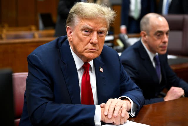 <p>Angela Weiss/AFP/Bloomberg via Getty Images</p> Donald Trump at the Manhattan criminal court where he will be tried on 34 felony counts of falsified business records