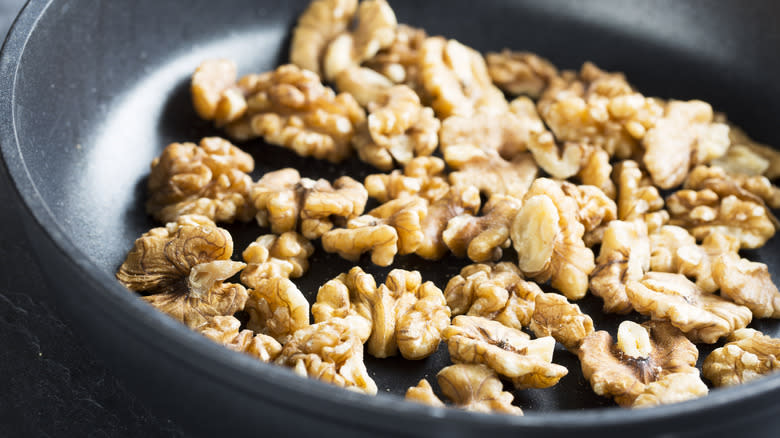 Walnuts toasting in pan