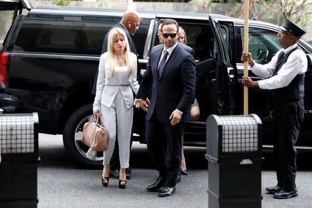 Former Trump campaign aide George Papadopoulos with his wife Simona Mangiante arrives for his sentencing hearing at U.S. District Court in Washington, U.S., September 7, 2018. REUTERS/Yuri Gripas