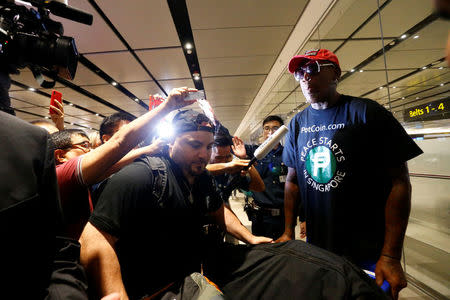 Former basketball player Dennis Rodman arrives at Changi Airport in Singapore, June 12, 2018. REUTERS/Feline Lim