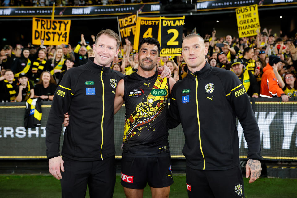 Richmond retirees Dylan Grimes, Marlion Pickett and Dustin Martin pose for a photo.