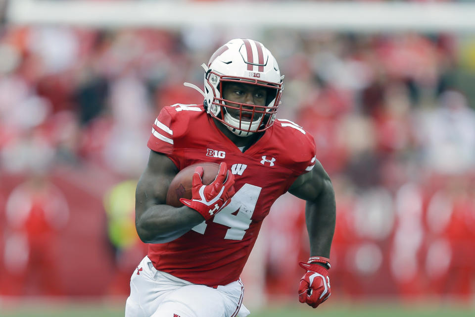 FILE - In this Oct. 12, 2019, file photo, Wisconsin running back Nakia Watson (14) carries during the first half of an NCAA college football game in Madison, Wis. Wisconsin’s rushing attack will look quite a bit different this season without Jonathan Taylor in the backfield. Wisconsin begins adjusting to life without Taylor on Friday night, Oct. 23, 2020, when the 14th-ranked Badgers host Illinois in their pandemic-delayed season opener.(AP Photo/Andy Manis, File)