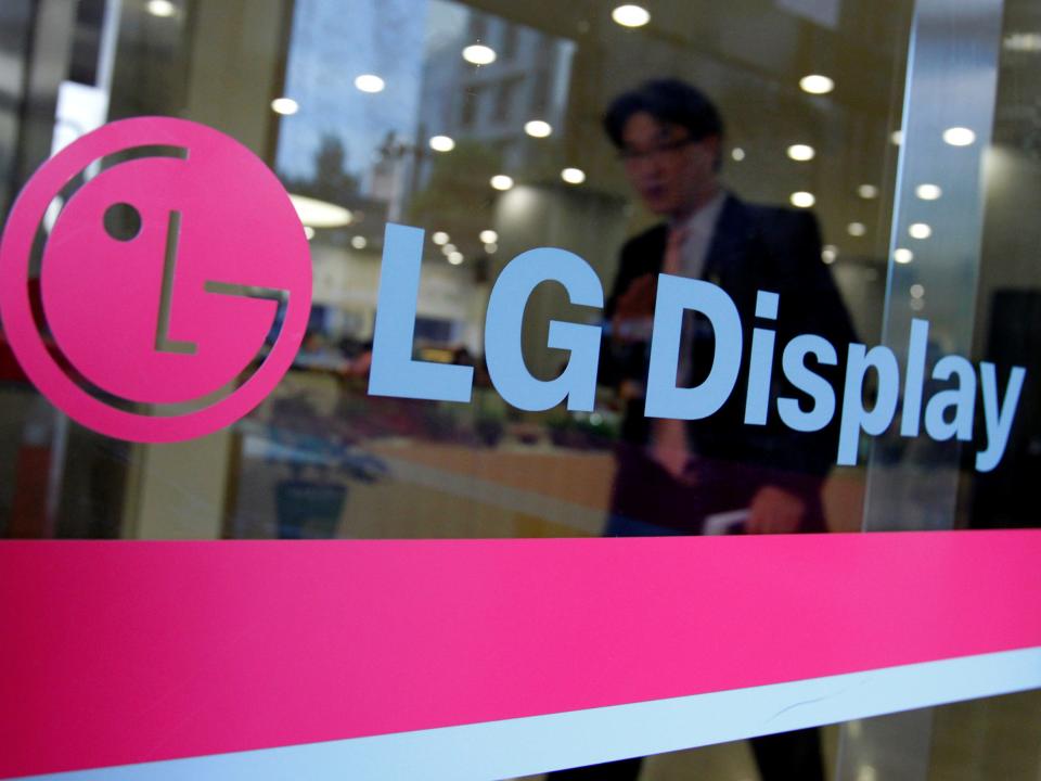 FILE PHOTO: A man walks out of the headquarters of LG Display in Seoul, October 20, 2011.  REUTERS/Jo Yong-Hak/File Photo  