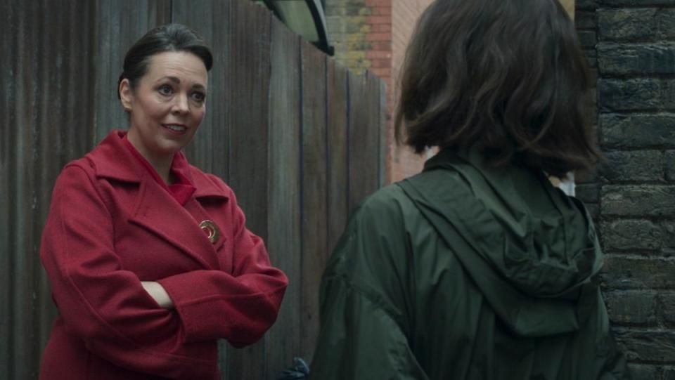 Olivia Coleman in a red coat speaks to Gi'ah in an alley on Secret Invasion