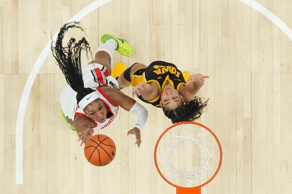 Jan 21, 2024; Columbus, Ohio, USA; Ohio State Buckeyes forward Cotie McMahon (32) shoots over Iowa Hawkeyes forward Hannah Stuelke (45) during the NCAA women’s basketball game at Value City Arena. Ohio State won 100-92.