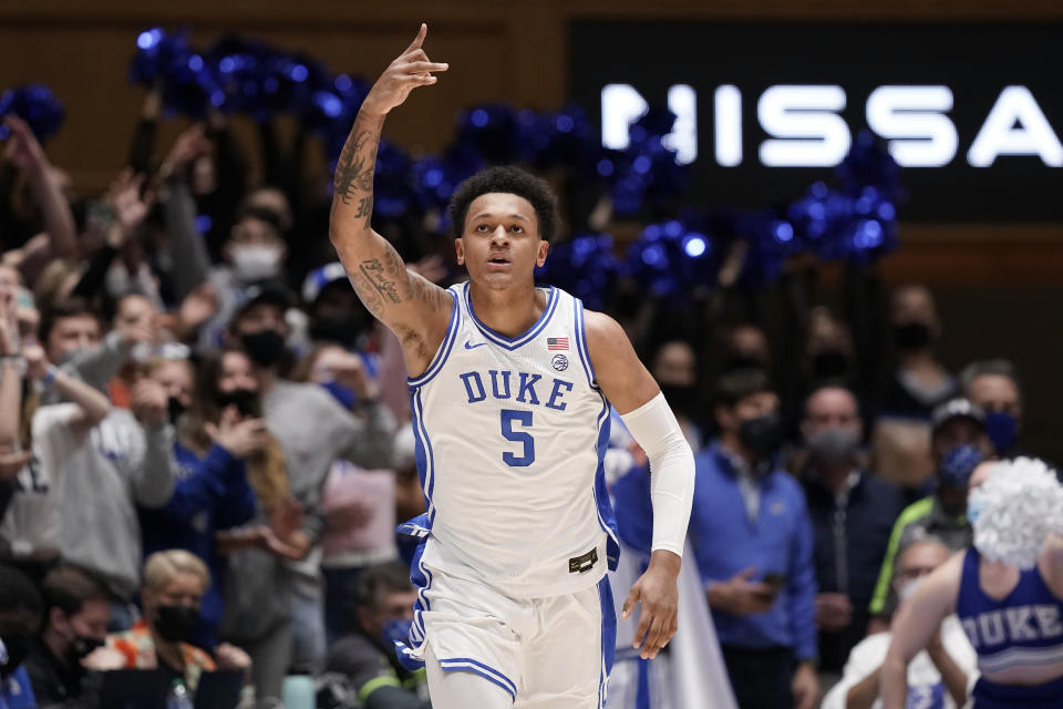 Duke forward Paolo Banchero (5) reacts following a basket against Clemson during the first half of an NCAA college basketball game in Durham, N.C., Tuesday, Jan. 25, 2022. (AP Photo/Gerry Broome)