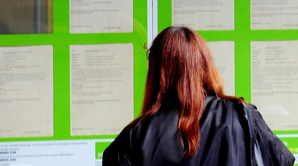 A woman looking into the window of a job centre (Rui Vieira/PA) (PA Archive)