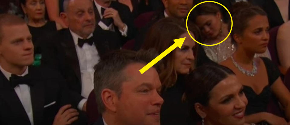 An audience shot showing Chrissy asleep on John Legend's shoulder in the corner of the frame