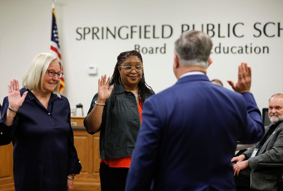 Judy Brunner and Shurita Thomas-Tate are sworn in to the Springfield Public Schools Board of Education by Greene County Clerk Shane Scholler at a meeting on Tuesday, April 11, 2023. 
