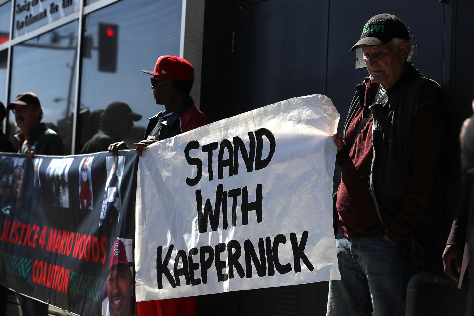 Protesters demonstrate in support of San Francisco 49ers quarterback Colin Kaepernick outside of the San Francisco Police Officers Association offices on August 31, 2016 in San Francisco. (Getty)