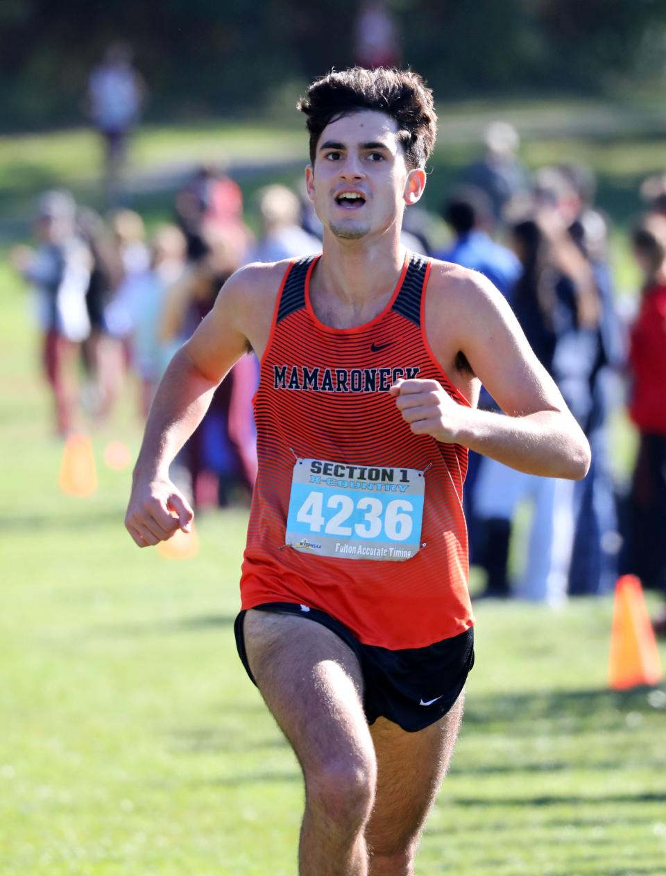 Jason Markopoulis from Mamaroneck crosses the finish line in the boys Section One Class A cross country championships.