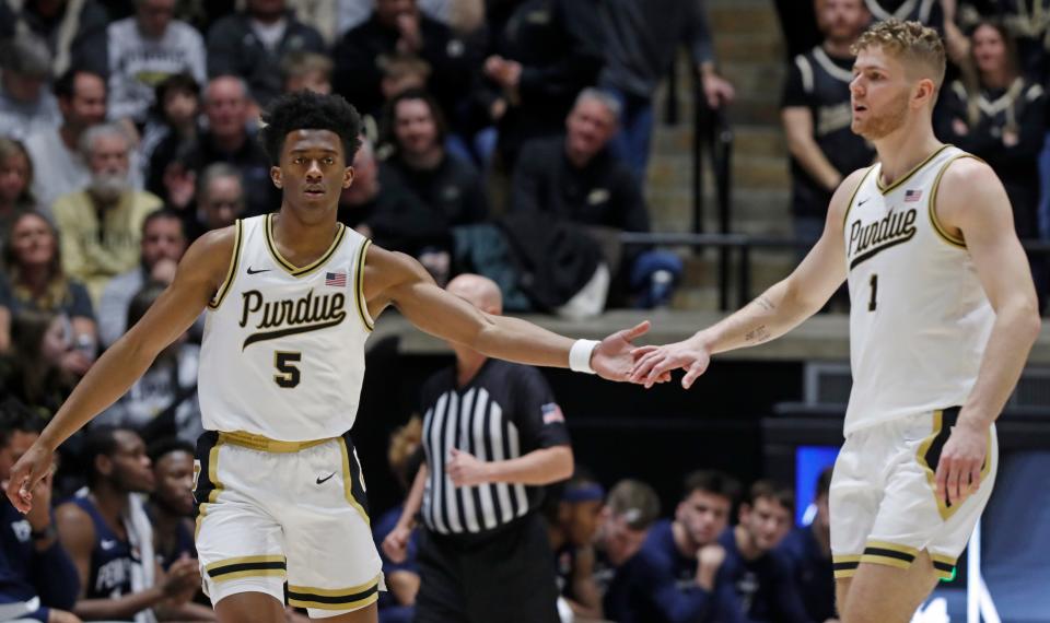 Purdue Boilermakers guard Myles Colvin (5) and Purdue Boilermakers forward Caleb Furst (1) high-five during the NCAA men’s basketball game against the Penn State Nittany Lions, Saturday, Jan. 13, 2024, at Mackey Arena in West Lafayette, Ind.
