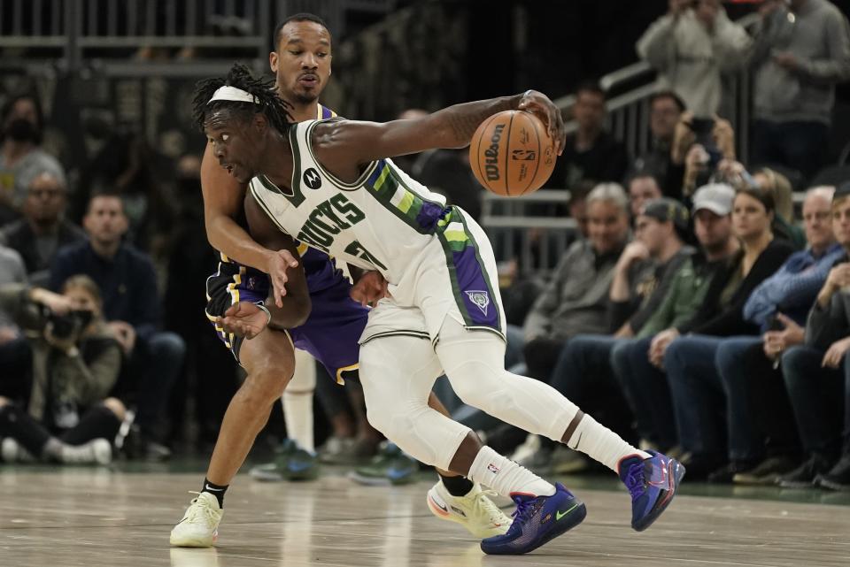 Milwaukee Bucks' Grayson Allen tries to drive past Los Angeles Lakers' Avery Bradley during the first half of an NBA basketball game Wednesday, Nov. 17, 2021, in Milwaukee. (AP Photo/Morry Gash)