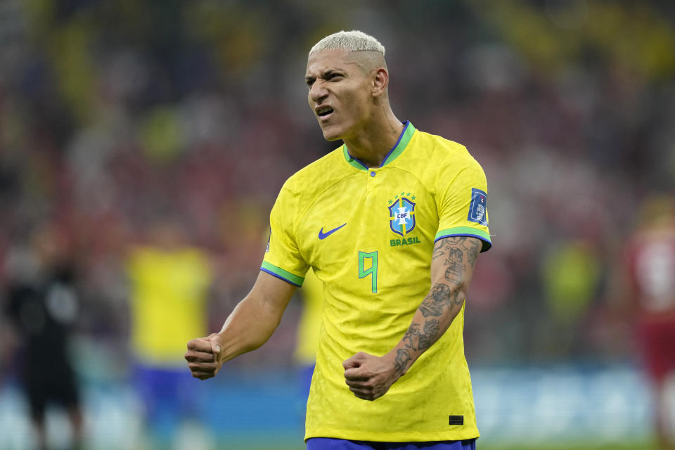 Brazil's Richarlison celebrates after scoring the opening goal during the World Cup group G soccer match between Brazil and Serbia, at the Lusail Stadium in Lusail, Qatar, Thursday, Nov. 24, 2022. (AP Photo/Andre Penner)